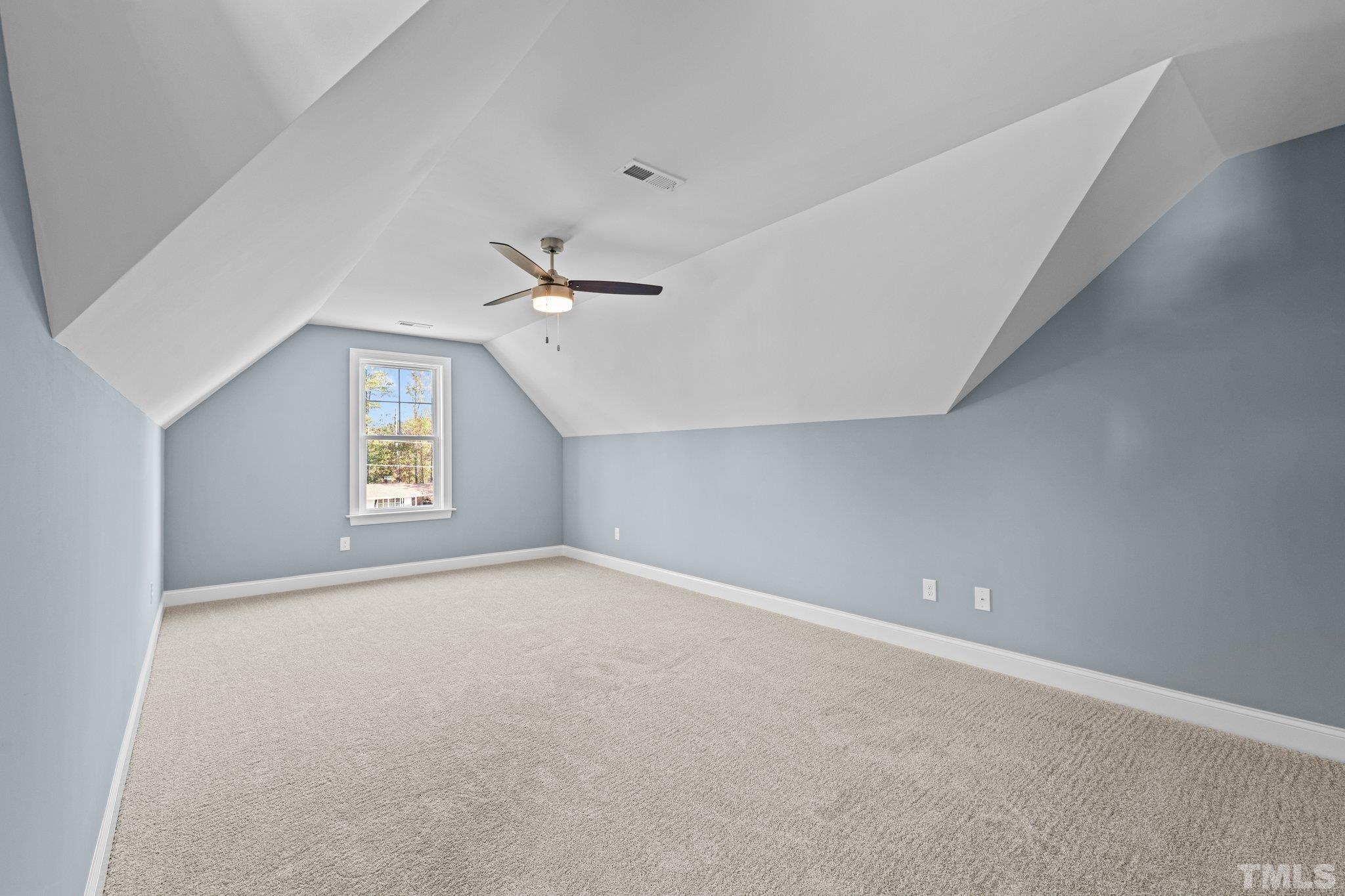 454 Pine Ridge Road Zebulon, NC 27597 - Photo 22 of 42 a view of an empty room with a window