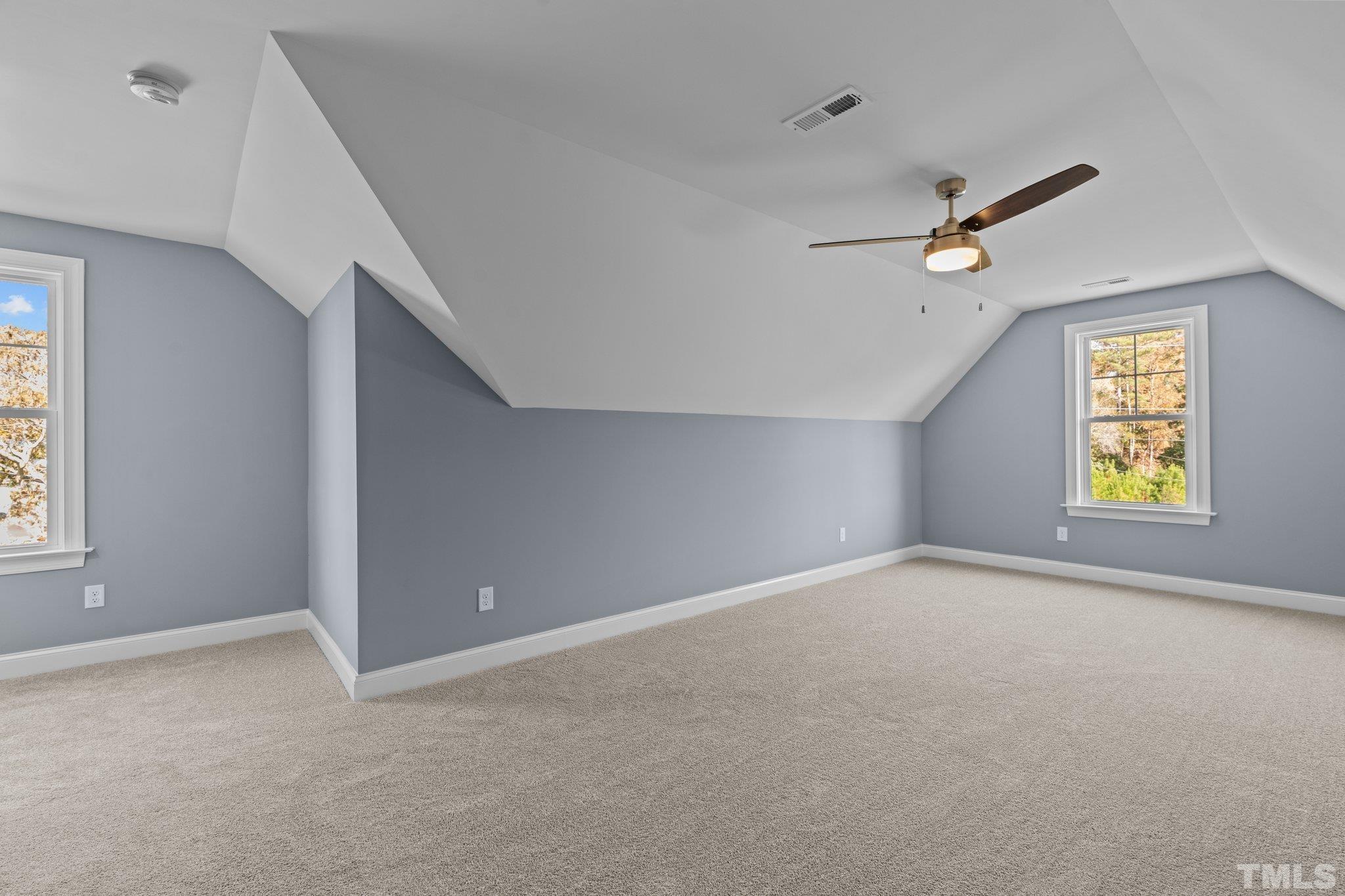 454 Pine Ridge Road Zebulon, NC 27597 - Photo 23 of 42 a view of an empty room with a window