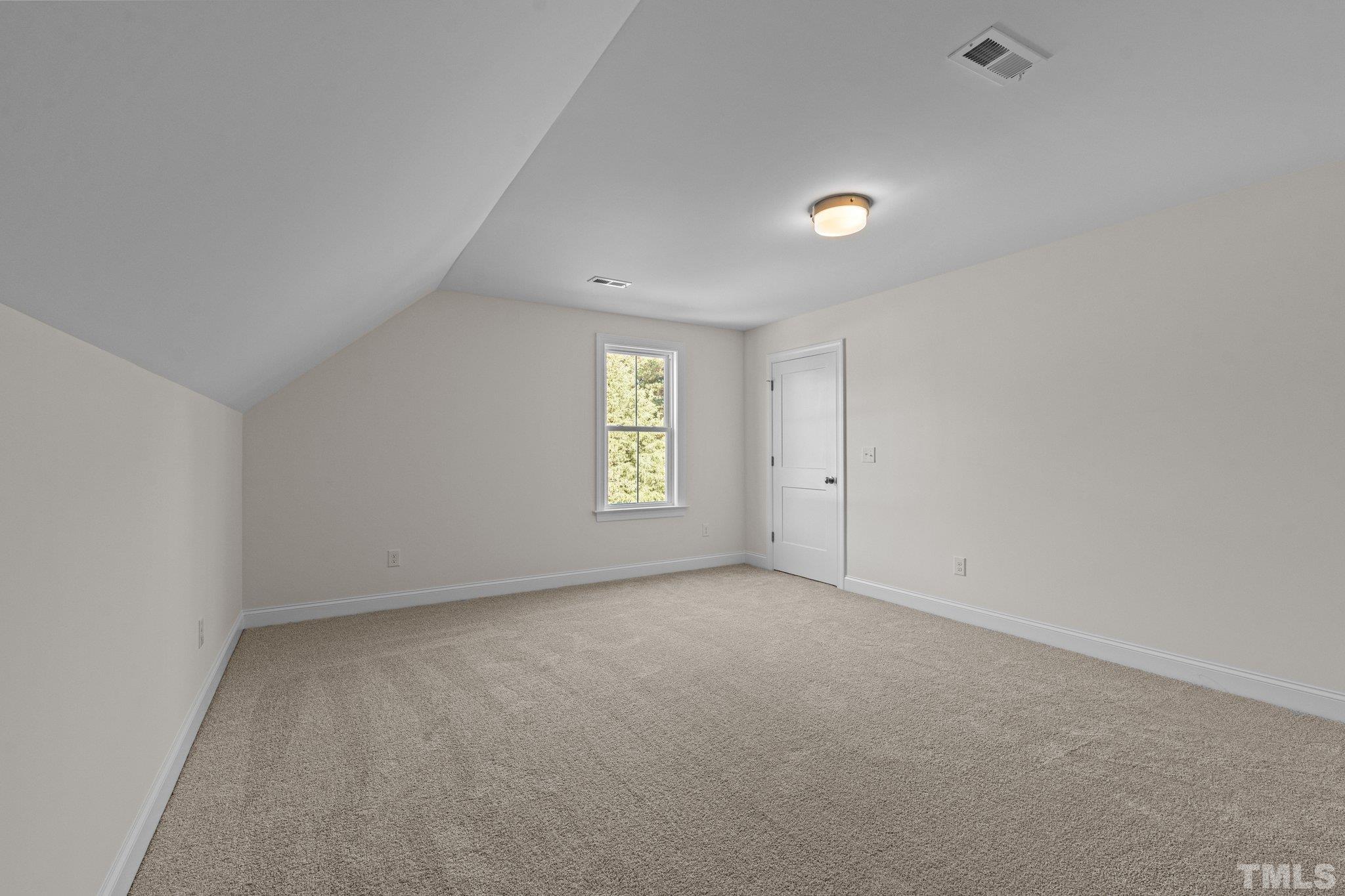 454 Pine Ridge Road Zebulon, NC 27597 - Photo 24 of 42 a view of an empty room with a window