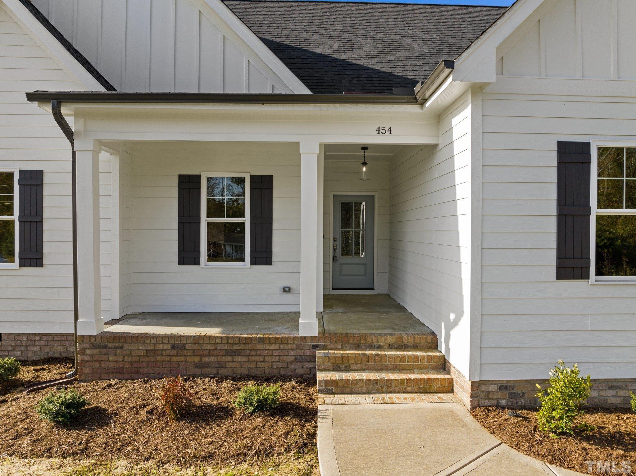 454 Pine Ridge Road Zebulon, NC 27597 - Photo 3 of 42 a front view of a house