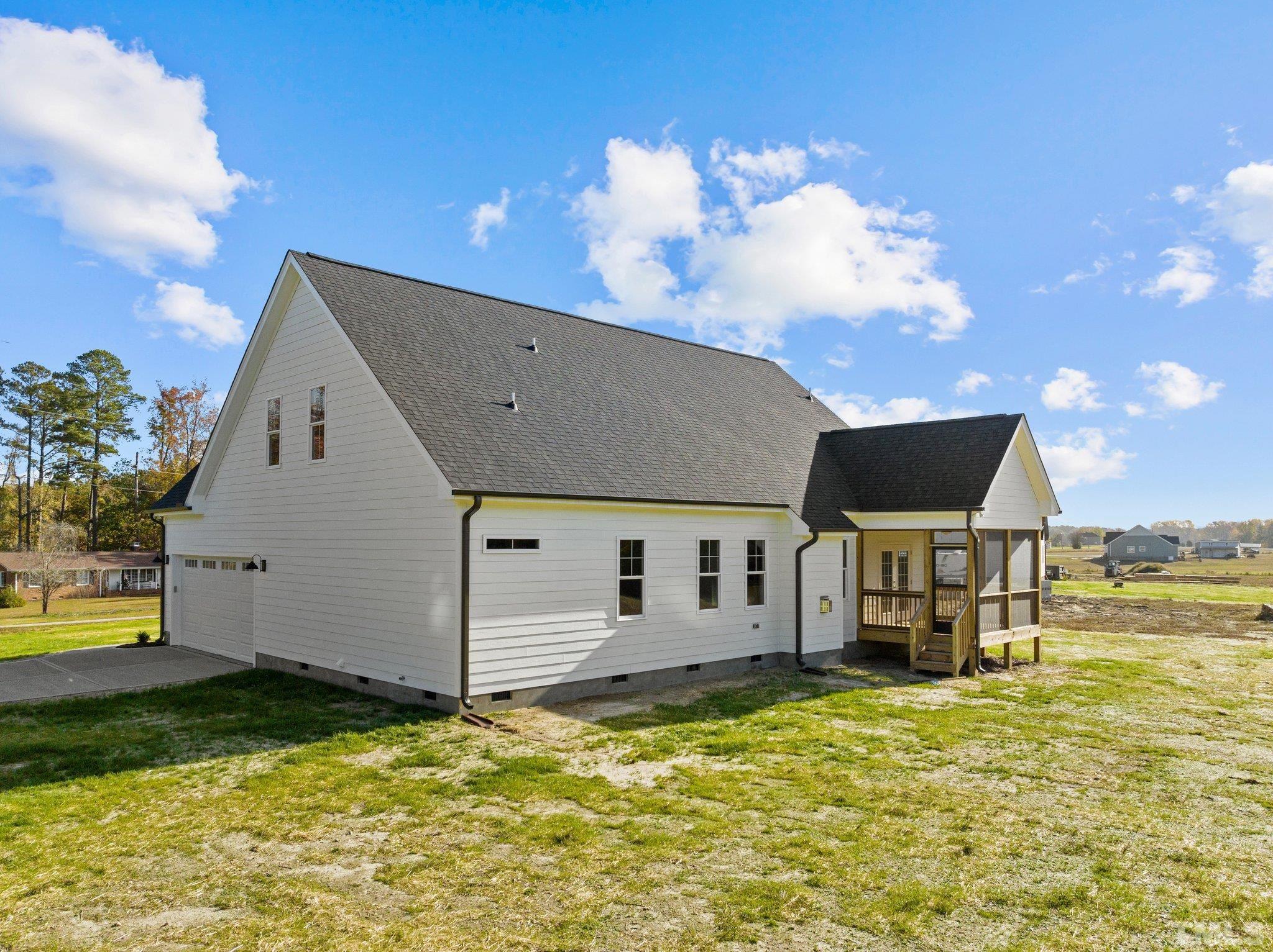 454 Pine Ridge Road Zebulon, NC 27597 - Photo 31 of 42 a view of a house with a swimming pool
