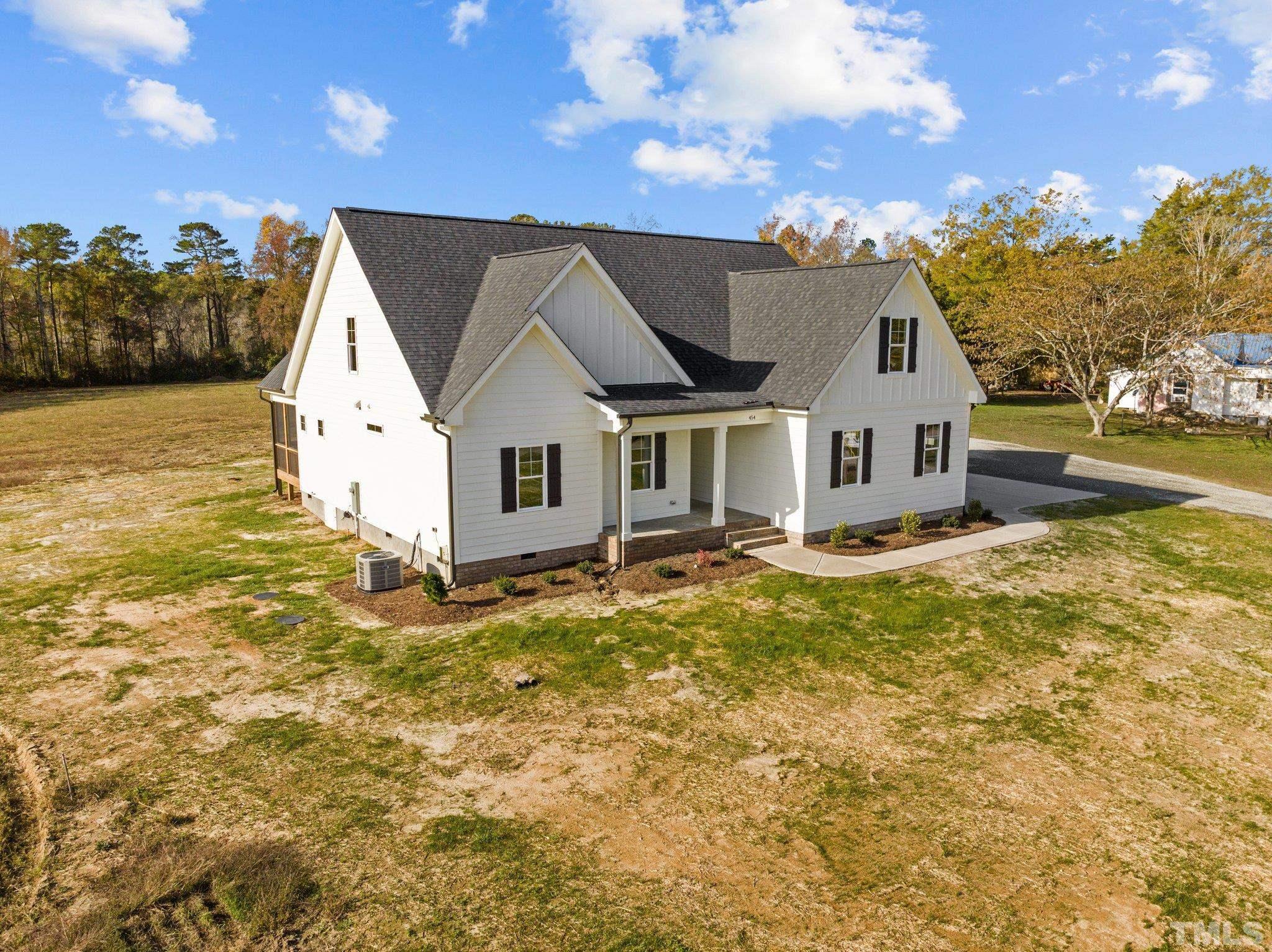 454 Pine Ridge Road Zebulon, NC 27597 - Photo 39 of 42 a view of a house with a yard