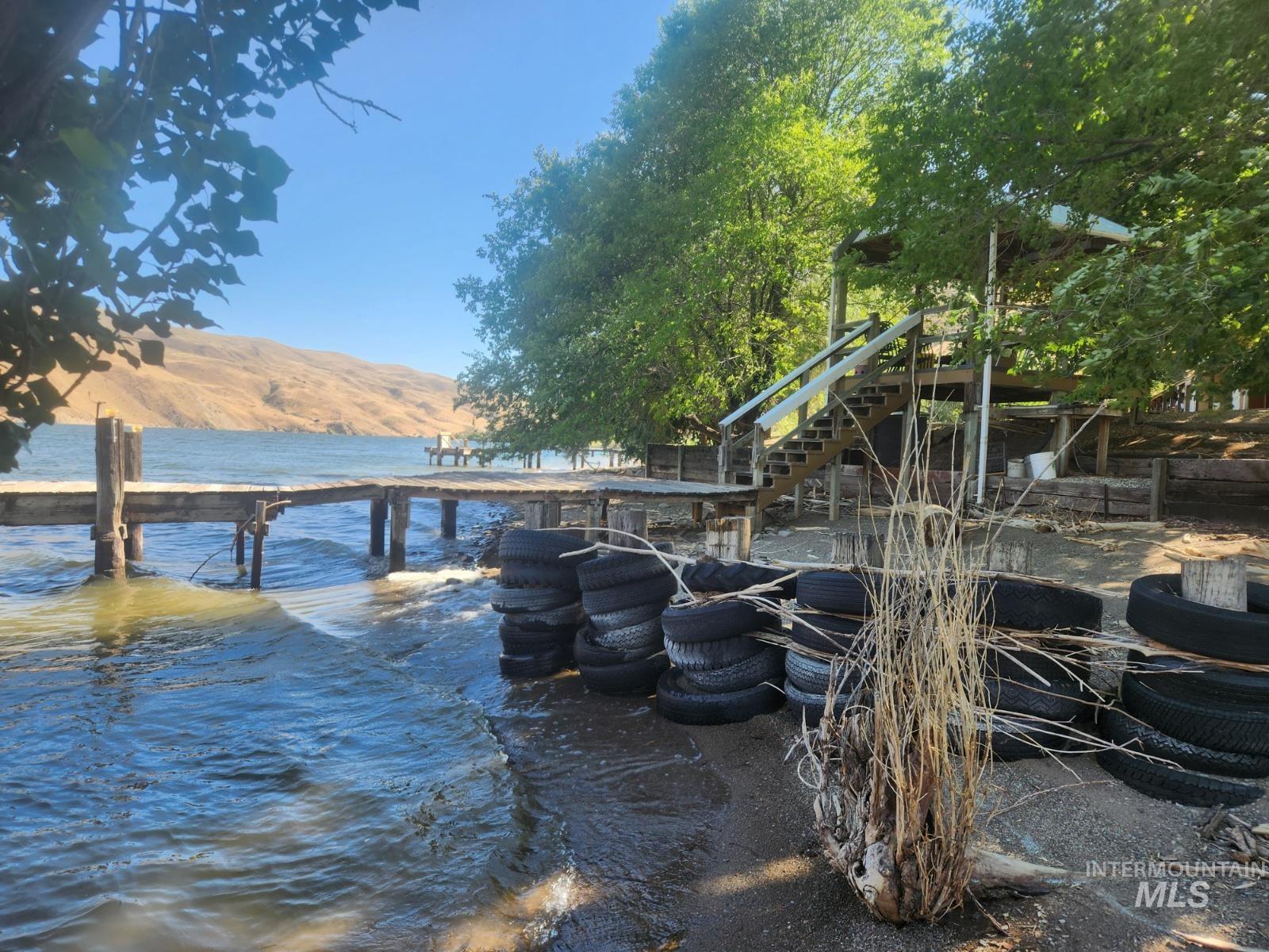 34559 Snake River Road Huntington, OR 97907 - Photo 3 of 49 Dock area featuring a water and mountain view and stairway