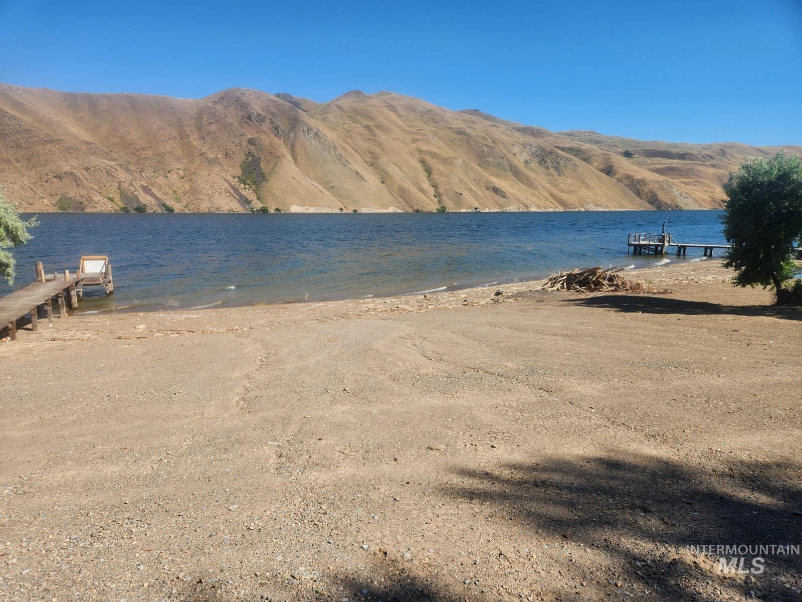 34559 Snake River Road Huntington, OR 97907 - Photo 34 of 49 Water view featuring a mountainous background and a dock