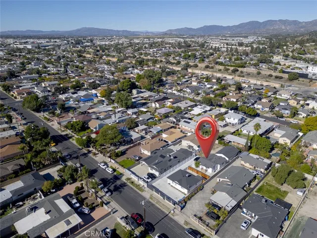 an aerial view of residential houses with outdoor space