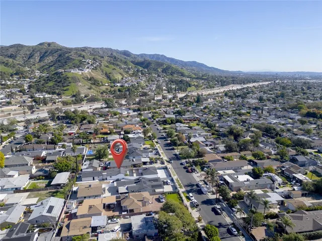 an aerial view of residential houses with outdoor space