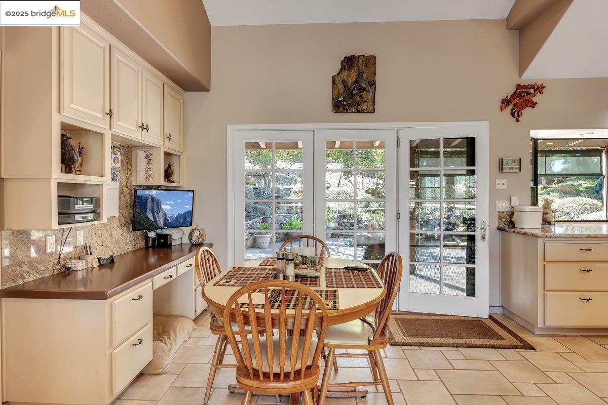 13700 Clements Road Groveland, CA 95321 - Photo 17 of 58 a view of a dining room with furniture window and outside view