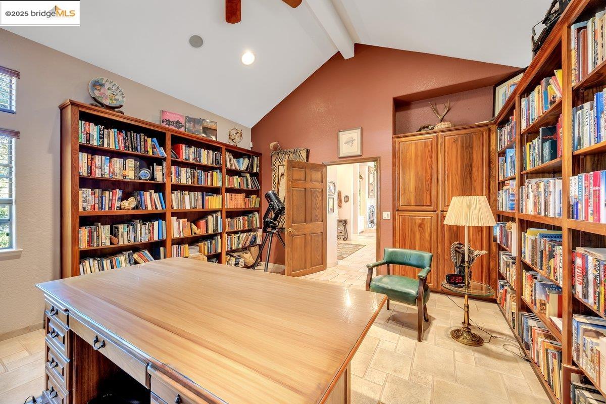 13700 Clements Road Groveland, CA 95321 - Photo 20 of 58 a bed room with a bed and a book shelf