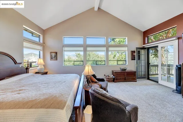a view of walk in closet with clothes