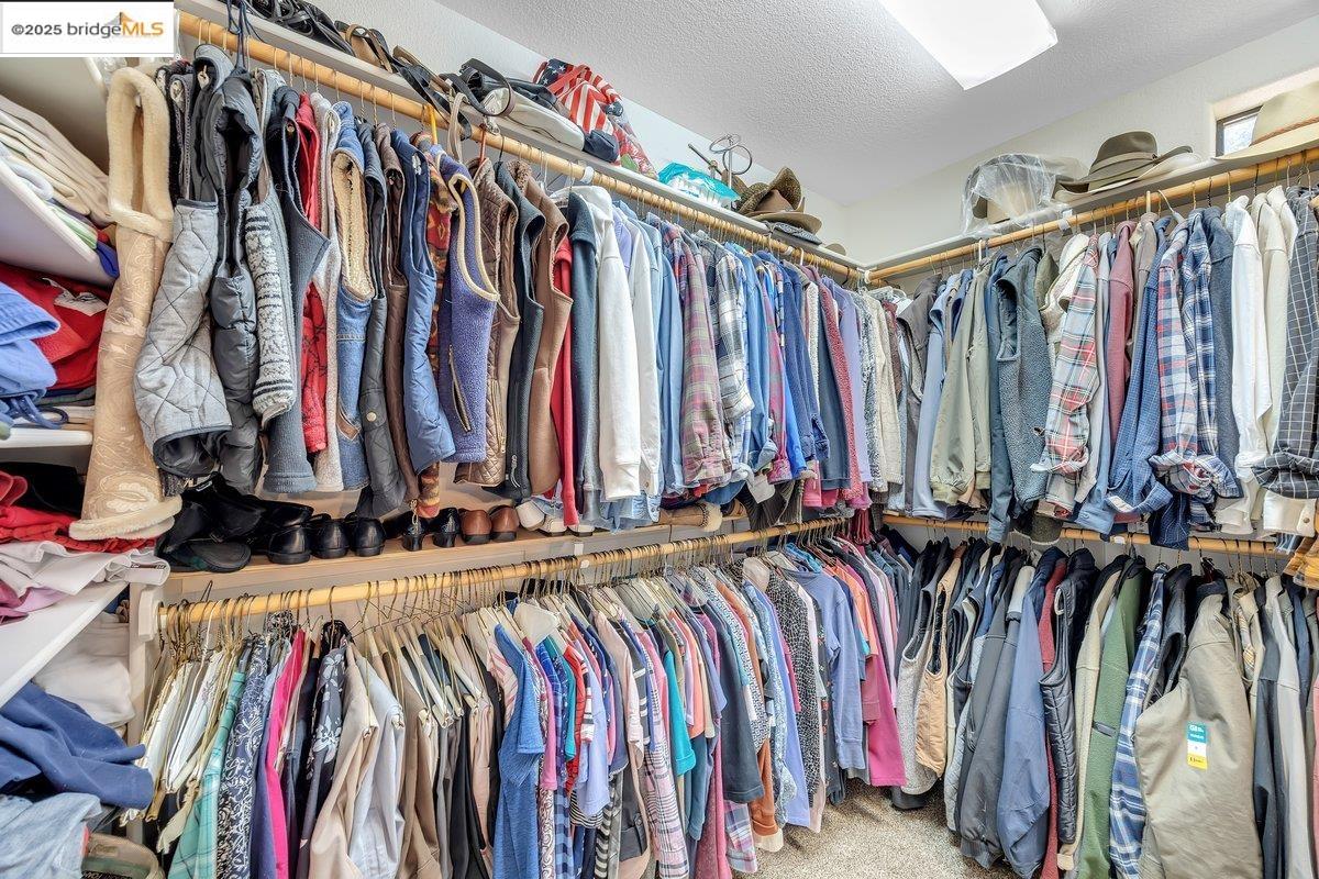 13700 Clements Road Groveland, CA 95321 - Photo 29 of 58 a view of walk in closet with clothes