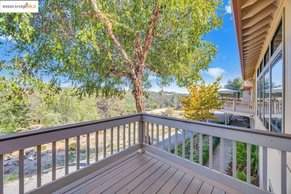 13700 Clements Road Groveland, CA 95321 - Photo 30 of 58 a view of a balcony with wooden floor