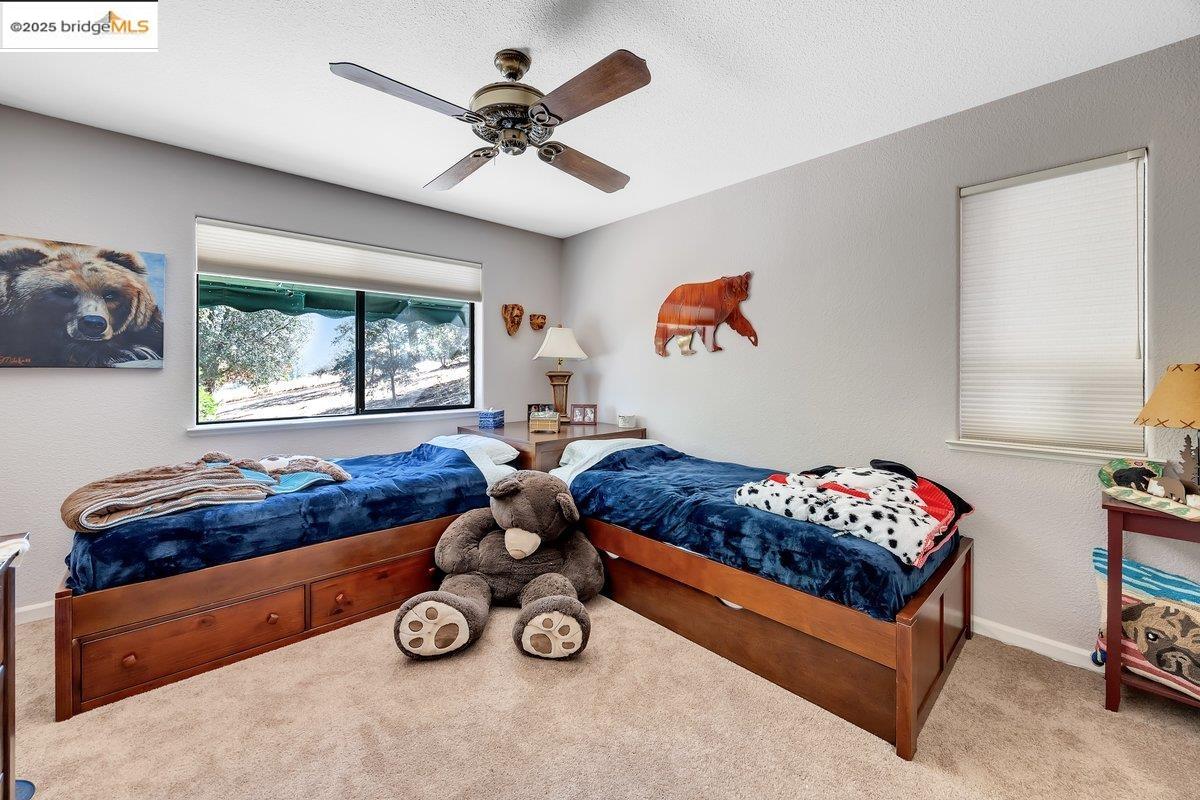 13700 Clements Road Groveland, CA 95321 - Photo 35 of 58 a bed room with furniture and a window