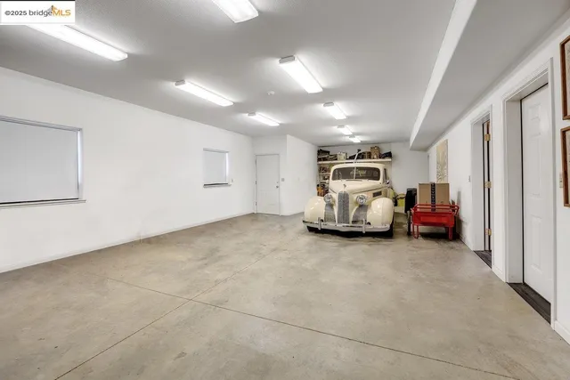 a view of a chairs and table in the patio