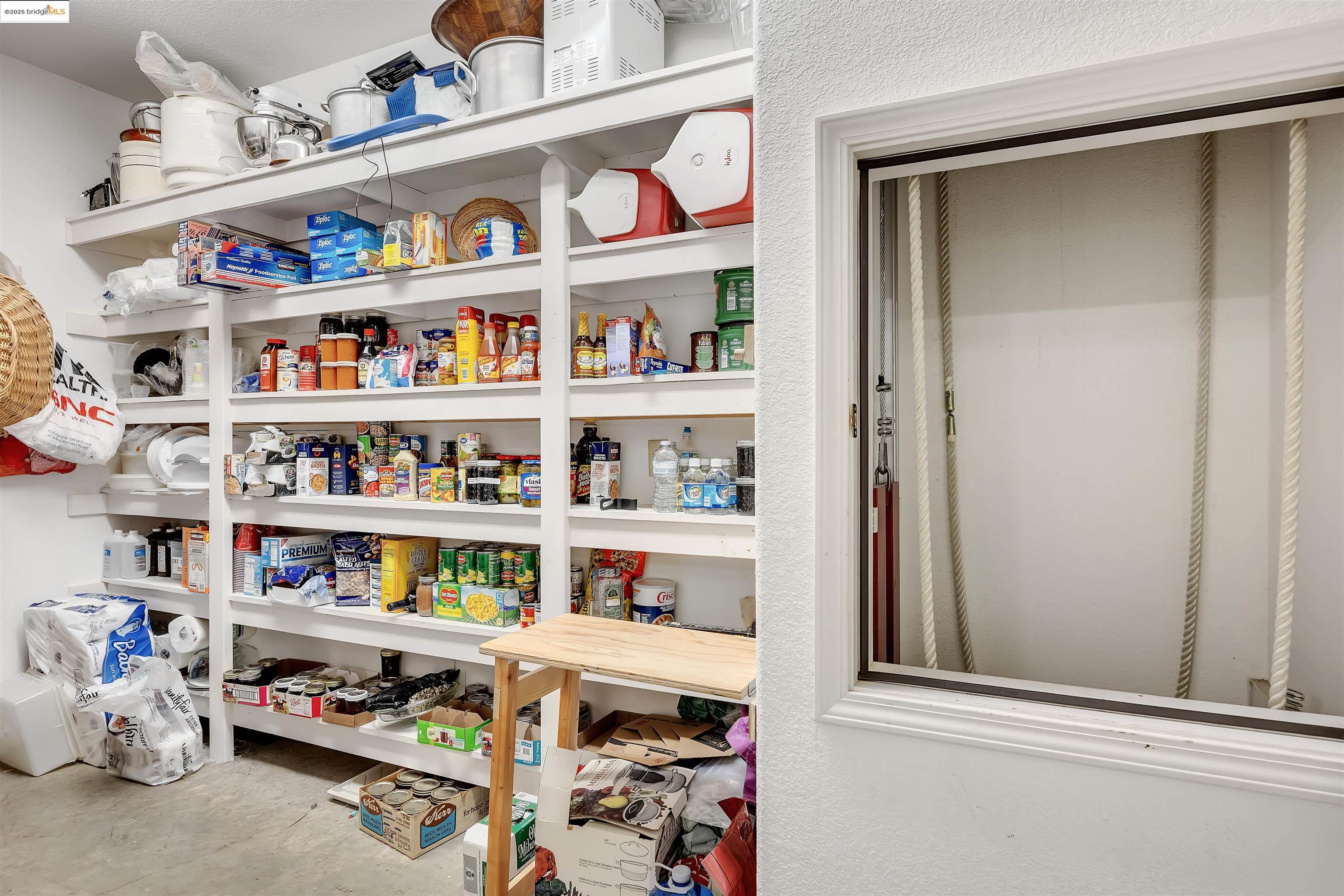 13700 Clements Road Groveland, CA 95321 - Photo 47 of 58 a room with storage and a shelf