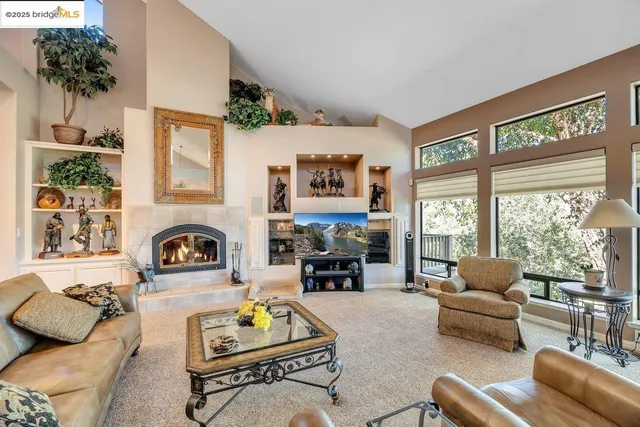 a living room with furniture and a table
