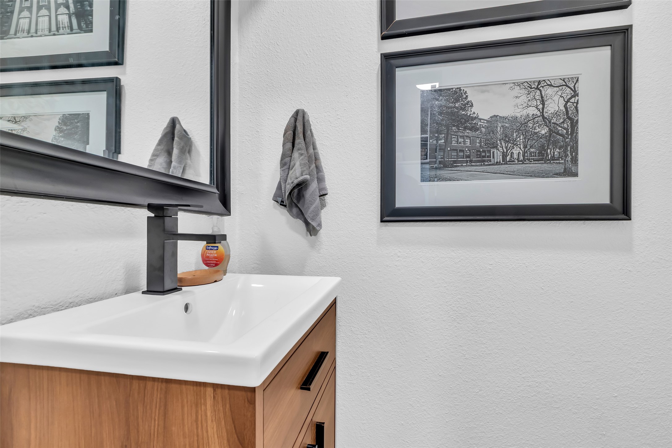 1831 Palm Street Houston, TX 77004 - Photo 17 of 26 This half bath, conveniently located near the kitchen, features a clean and functional design that adds practicality to the home’s main living area.