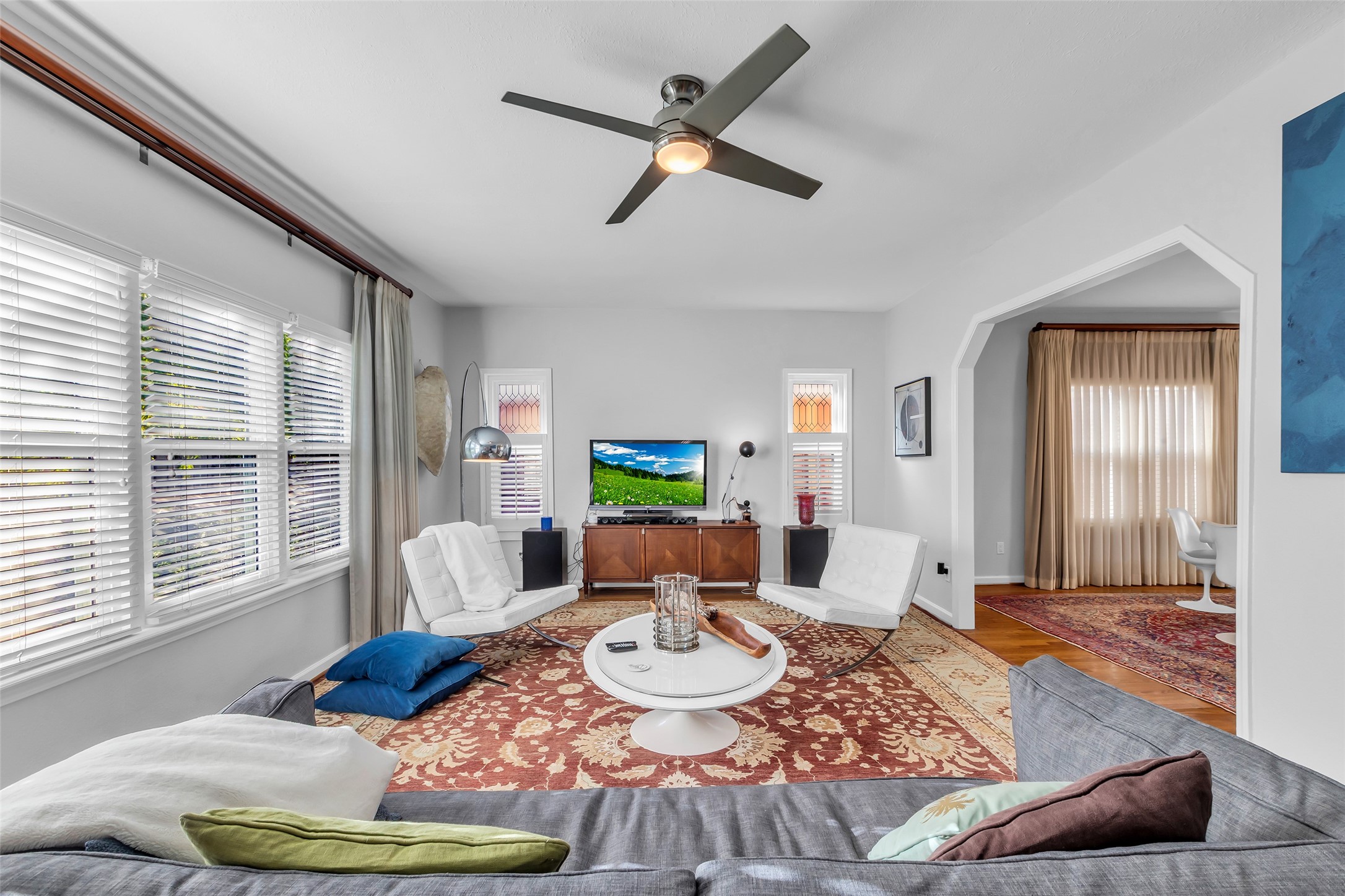 1831 Palm Street Houston, TX 77004 - Photo 5 of 26 The living room features a spacious layout with large windows overlooking the front lawn.