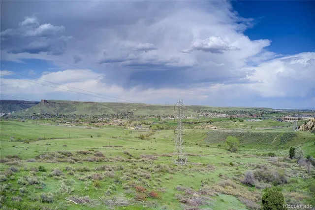 a view of a field with a mountain in the background
