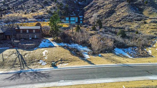 a big house with large windows and a yard