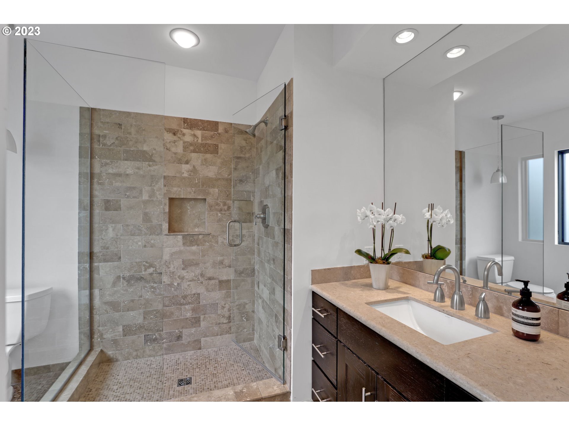4409 Southwest Carl Place Portland, OR 97239 - Photo 21 of 32 a bathroom with a sink vanity granite and a mirror