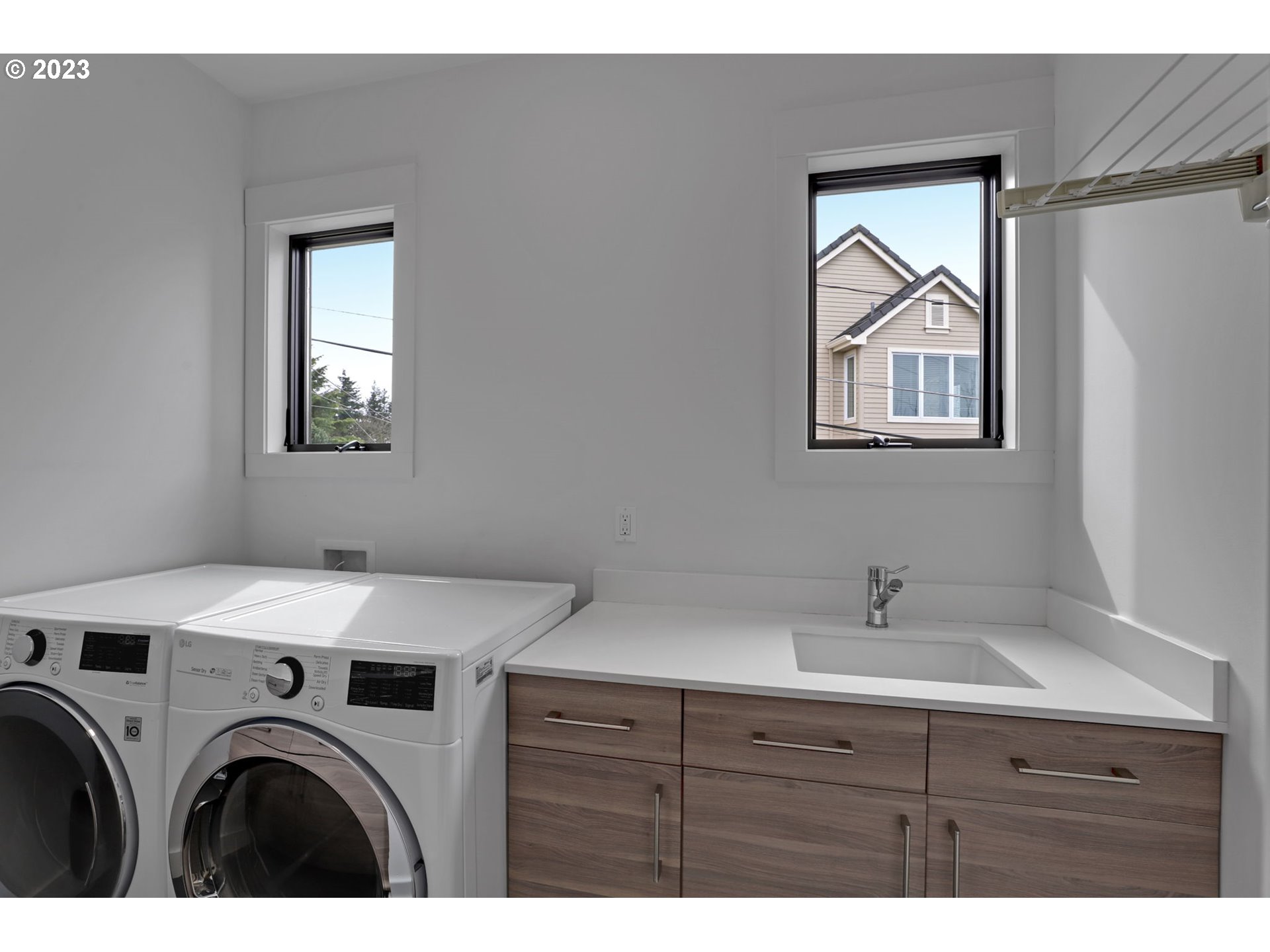 4409 Southwest Carl Place Portland, OR 97239 - Photo 27 of 32 a utility room with closet dryer and washer