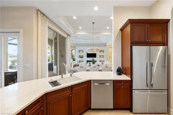 a view of a backyard with plants and a patio