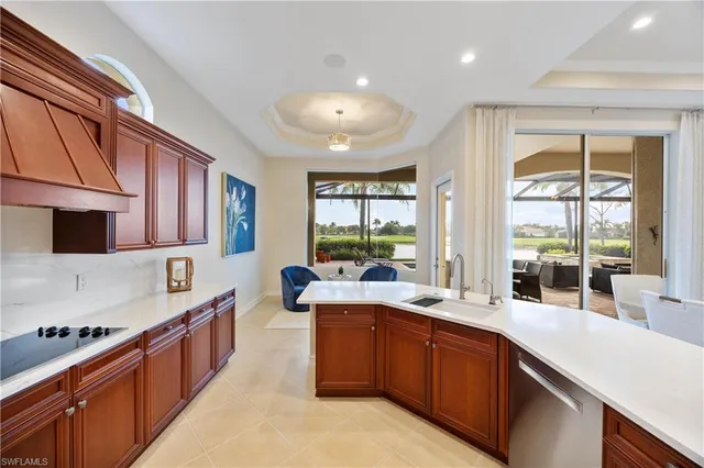 a kitchen with a sink stainless steel appliances and cabinets