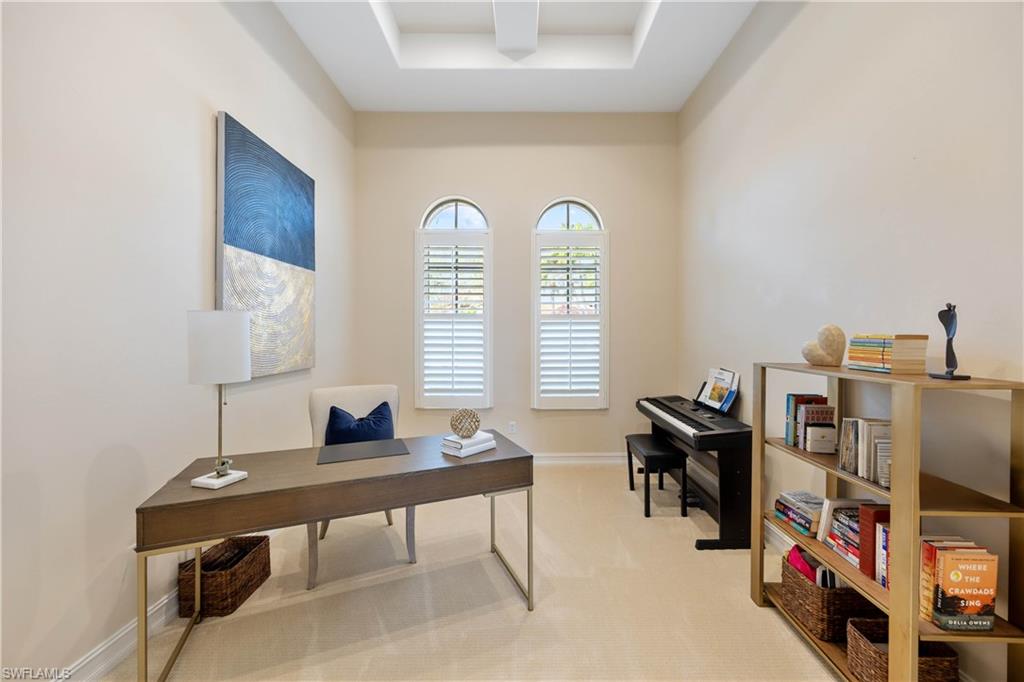 8950 Shenendoah Circle Naples, FL 34113 - Photo 21 of 48 a view of a workspace with furniture and a window