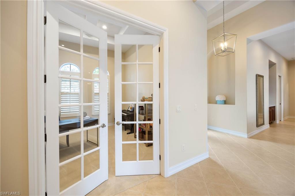 8950 Shenendoah Circle Naples, FL 34113 - Photo 22 of 48 a view of an empty room with window