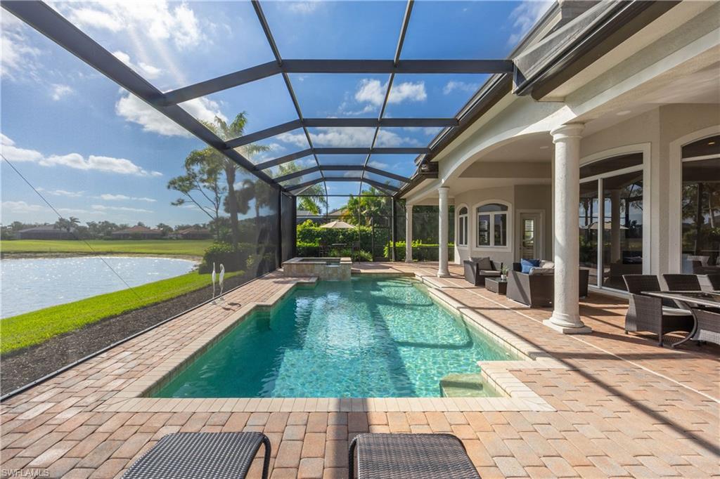 8950 Shenendoah Circle Naples, FL 34113 - Photo 28 of 48 a view of a swimming pool with a patio