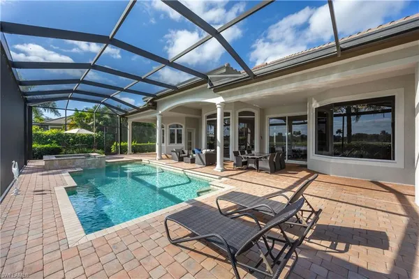 a view of a swimming pool with a patio