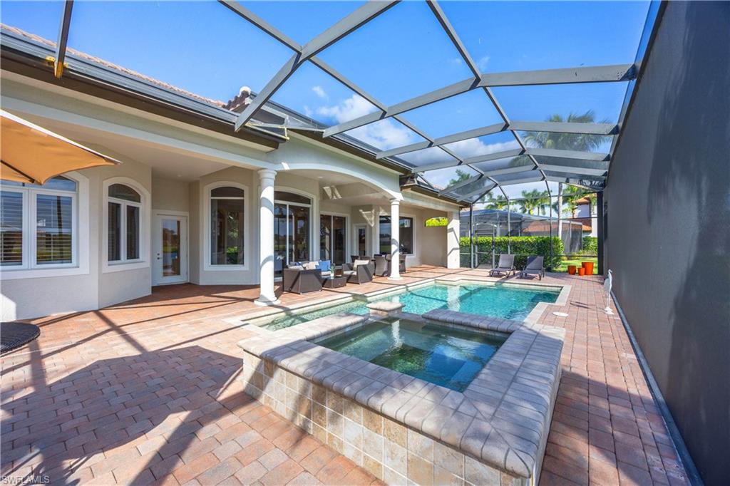 8950 Shenendoah Circle Naples, FL 34113 - Photo 33 of 48 a view of a house with backyard porch and sitting area