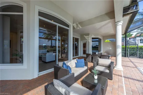 a view of a backyard with sitting area and porch