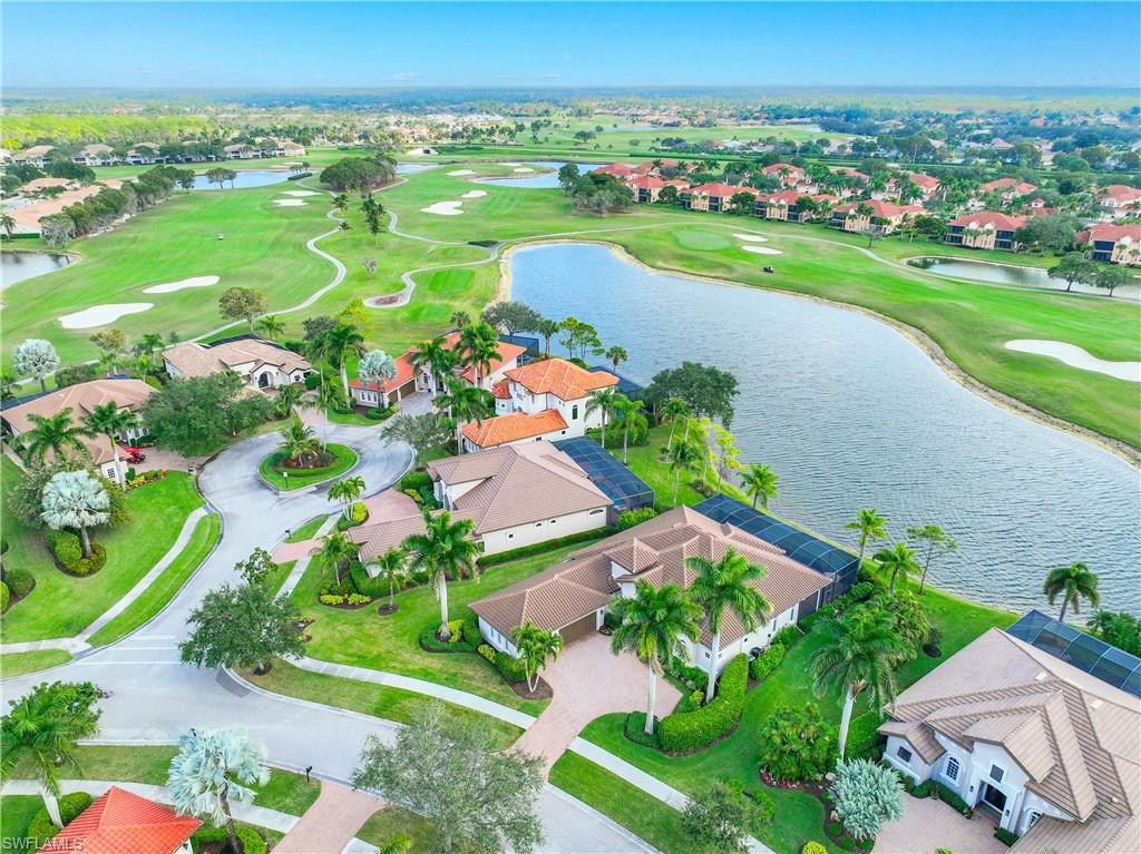 8950 Shenendoah Circle Naples, FL 34113 - Photo 37 of 48 an aerial view of a houses with a yard and lake view