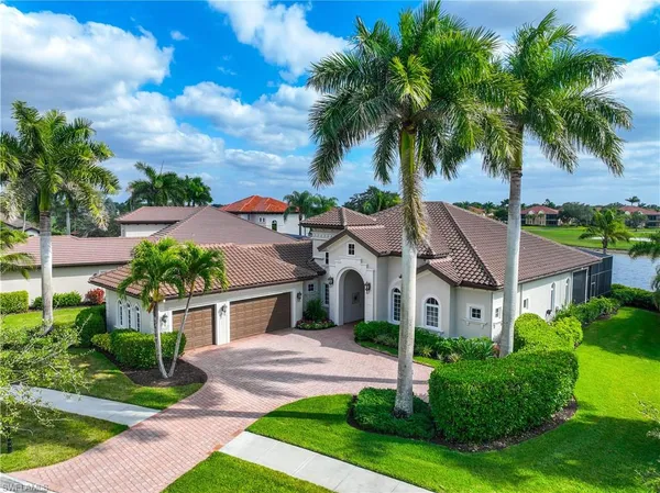 an aerial view of a house with a swimming pool yard and outdoor seating