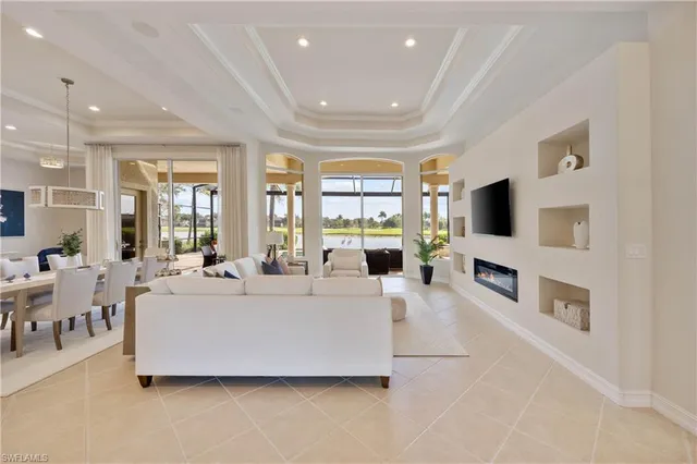 a living room with fireplace furniture and a flat screen tv