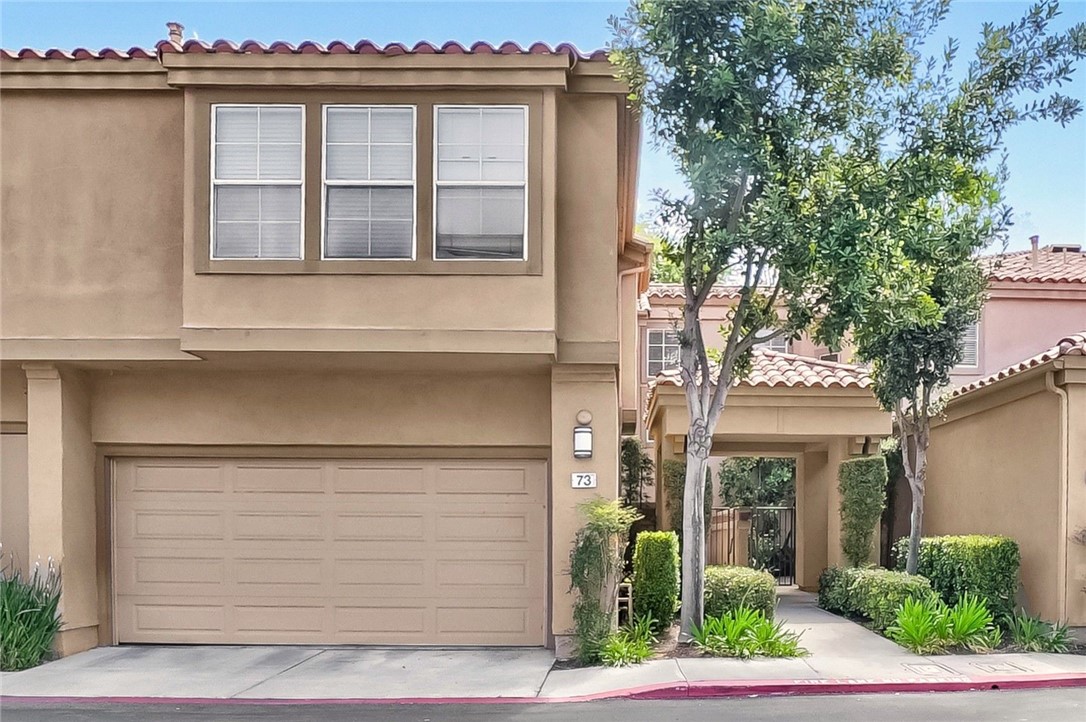 a front view of a house with garage