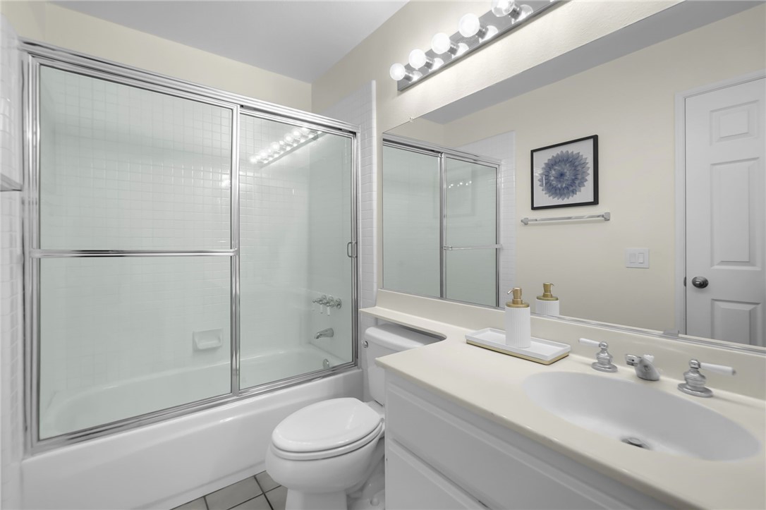 73 Cartier Aisle Irvine, CA 92620 - Photo 15 of 19 a bathroom with a sink toilet and shower