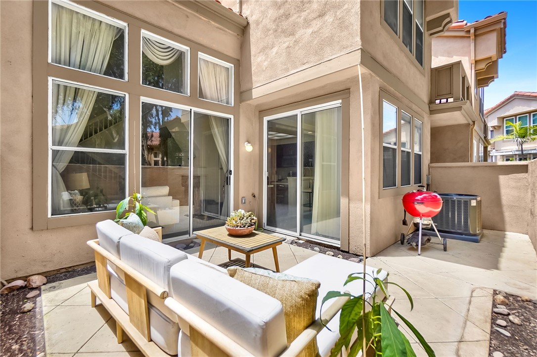 73 Cartier Aisle Irvine, CA 92620 - Photo 16 of 19 a view of a chairs and table in a patio
