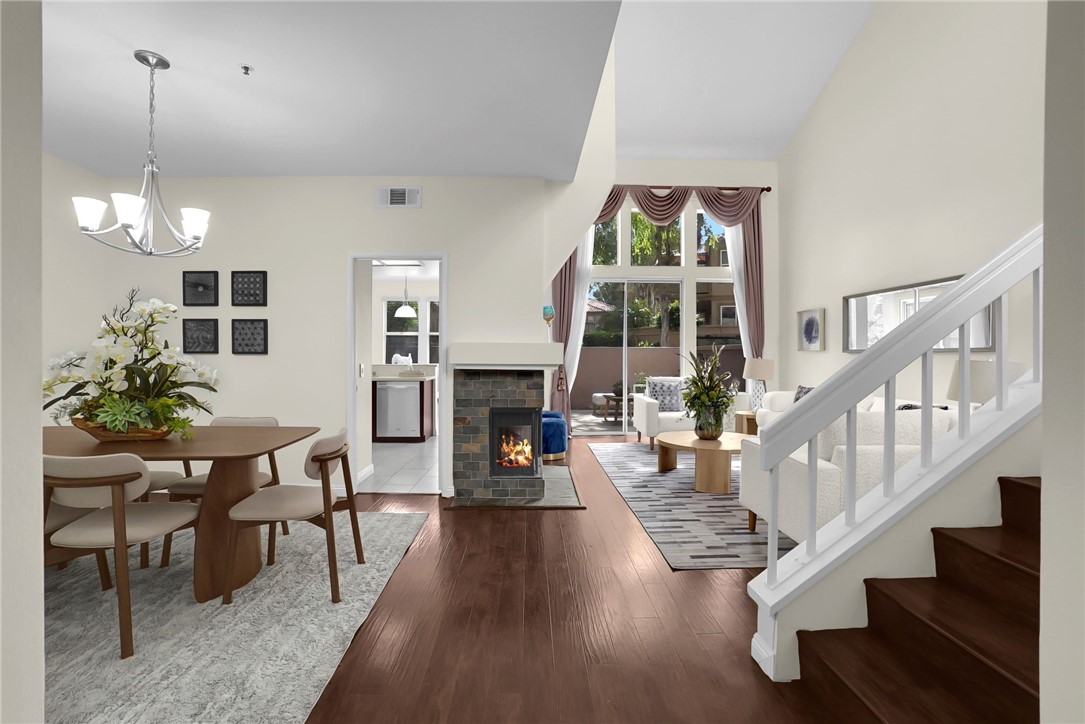 73 Cartier Aisle Irvine, CA 92620 - Photo 3 of 19 a living room with furniture large window and wooden floor