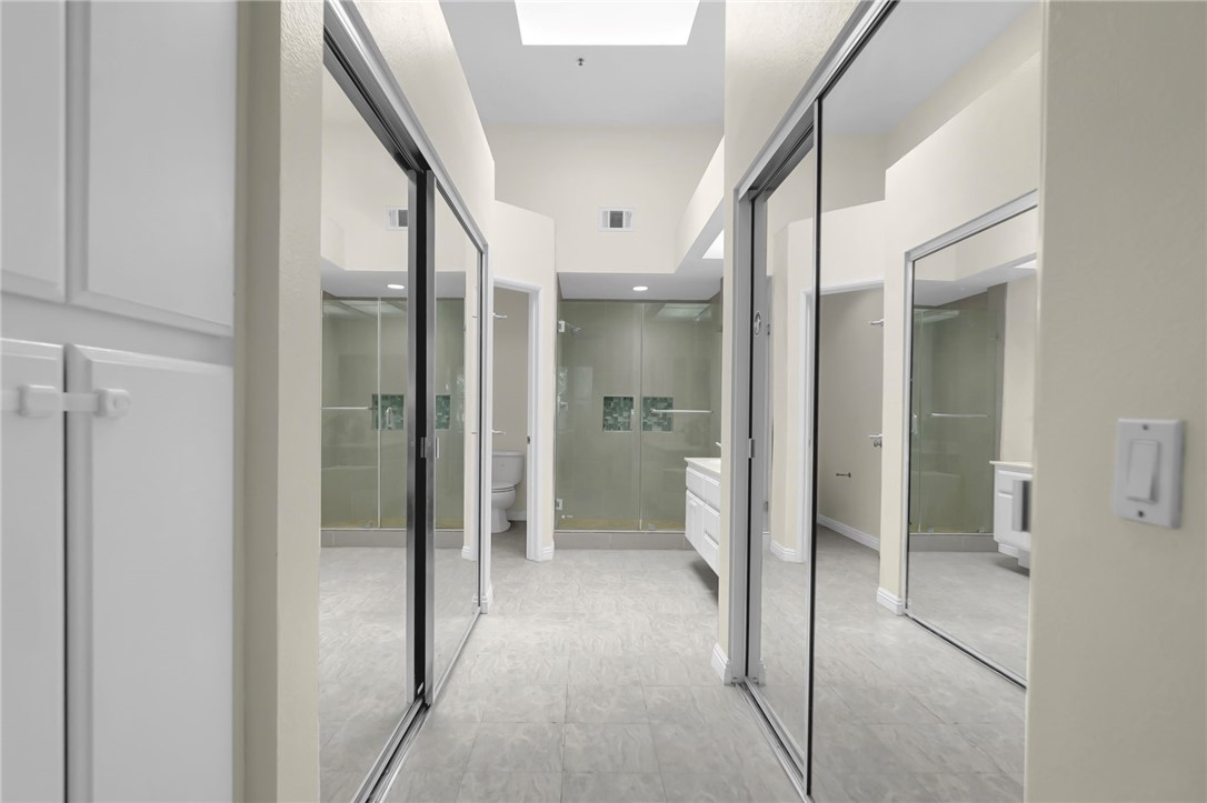 73 Cartier Aisle Irvine, CA 92620 - Photo 10 of 19 a bathroom with a glass door shower