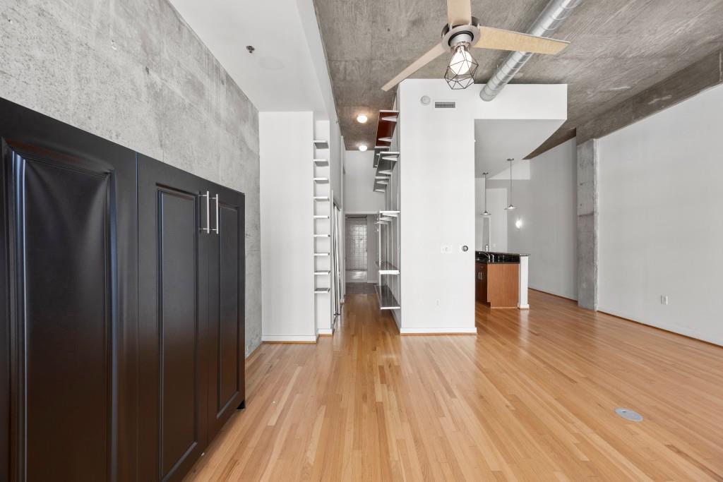 943 Peachtree Street Northeast, Unit 2009 Atlanta, GA 30309 - Photo 12 of 57 a view of a hallway with wooden floor