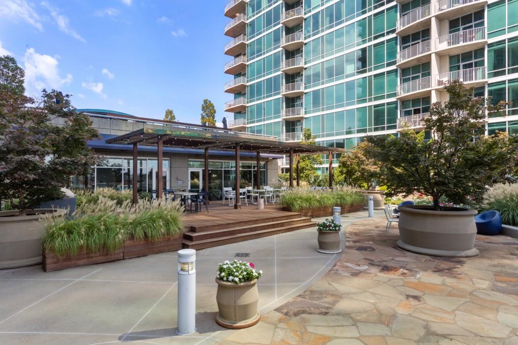 943 Peachtree Street Northeast, Unit 2009 Atlanta, GA 30309 - Photo 26 of 57 a view of a patio with plants and chairs