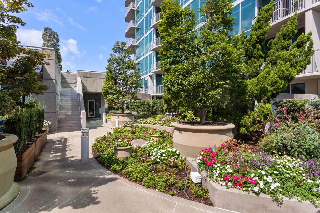 943 Peachtree Street Northeast, Unit 2009 Atlanta, GA 30309 - Photo 42 of 57 a view of a garden with flowers and trees