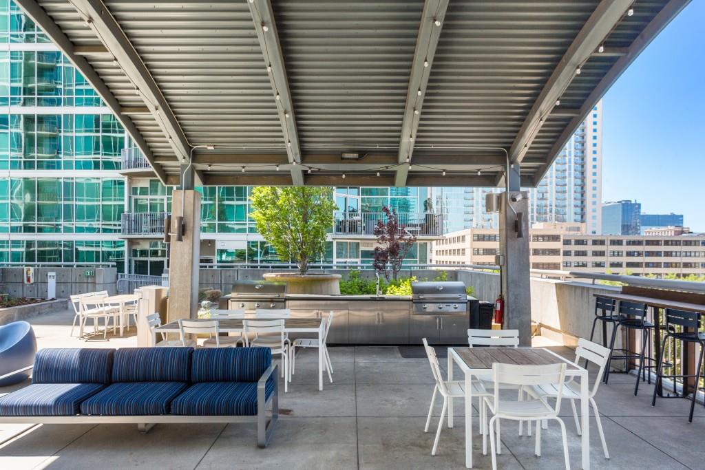 943 Peachtree Street Northeast, Unit 2009 Atlanta, GA 30309 - Photo 46 of 57 a building outdoor space with patio furniture and potted plants