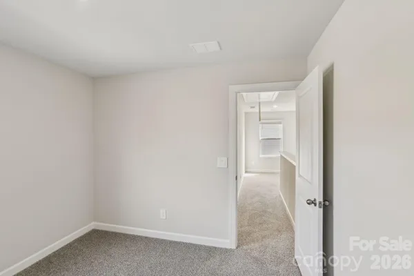 a view of an empty room with racks on the wall