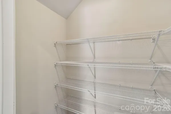 a view of an empty walk in closet