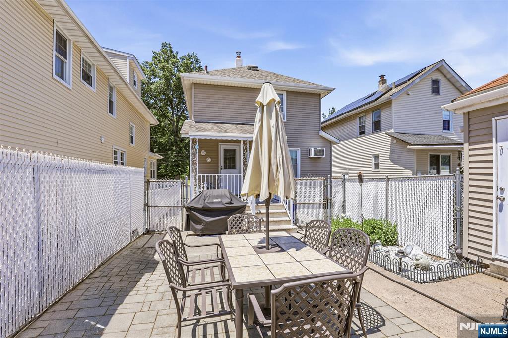 332 Riverside Avenue Lyndhurst, NJ 07071 - Photo 3 of 31 a view of house with patio outdoor seating and plants