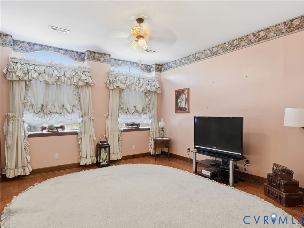 11152 Cross County Road Mineral, VA 23117 - Photo 13 of 29 a bedroom with a bed and a flat tv screen on the dresser
