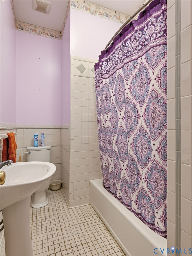 11152 Cross County Road Mineral, VA 23117 - Photo 18 of 29 a bathroom with a sink and mirror with toilet